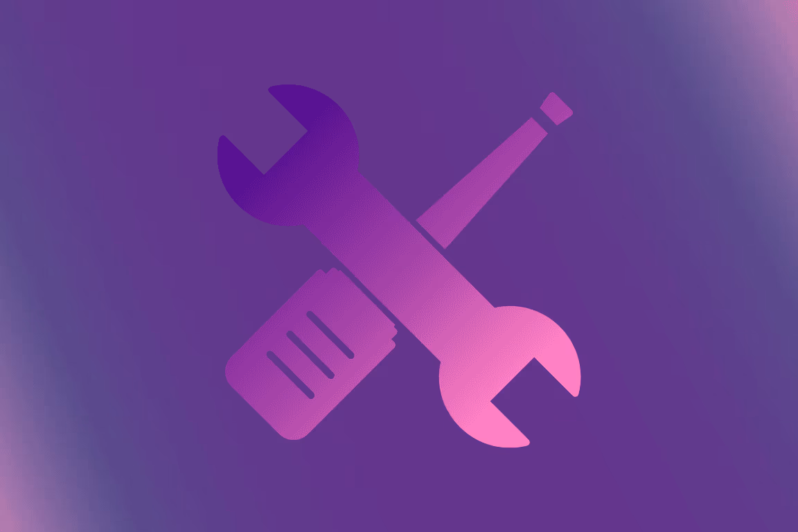 Toolkit of OnlyFans creator tools laid out around a laptop showing a fan dashboard